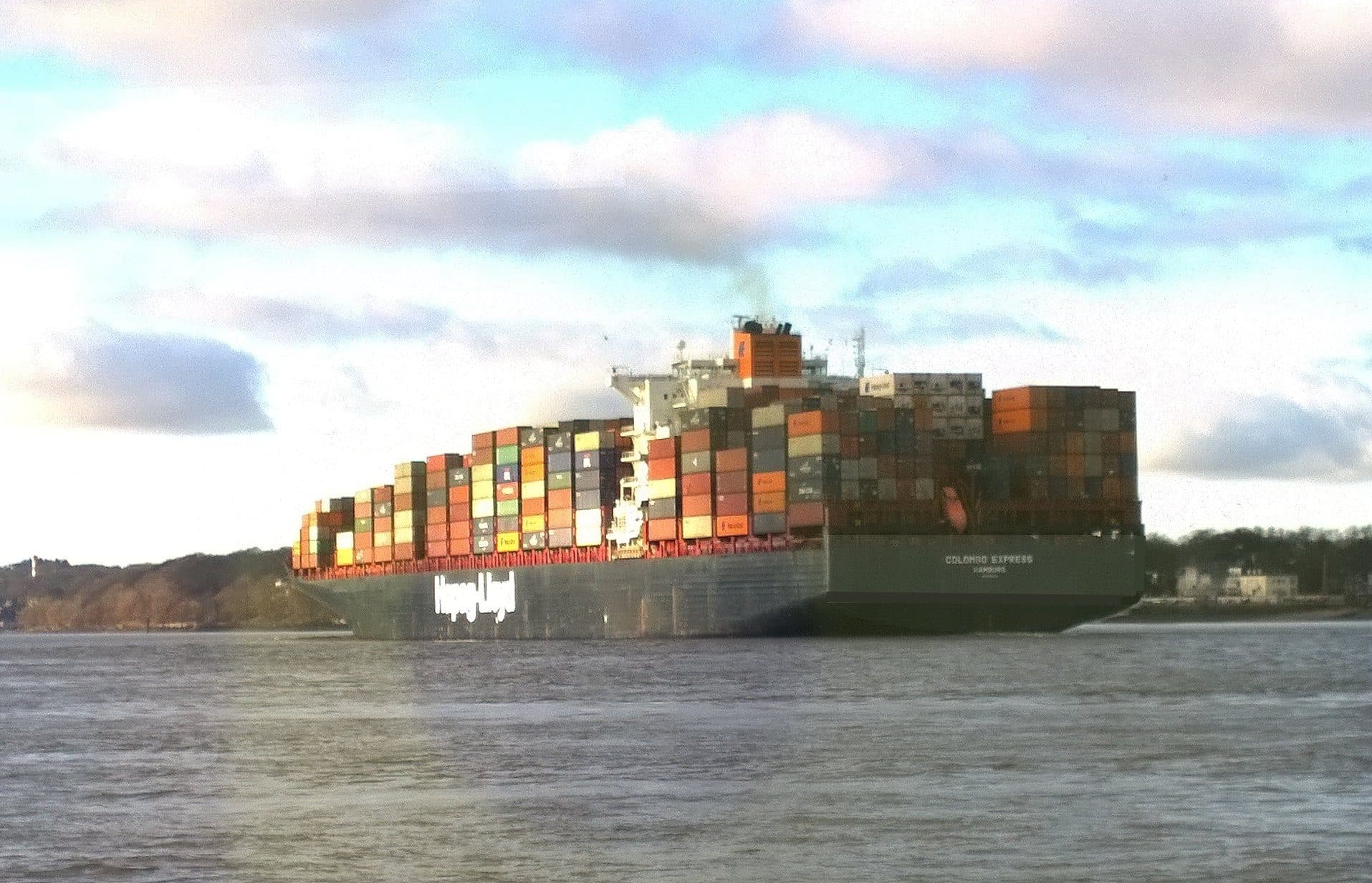 Loaded container ship underway on open water
